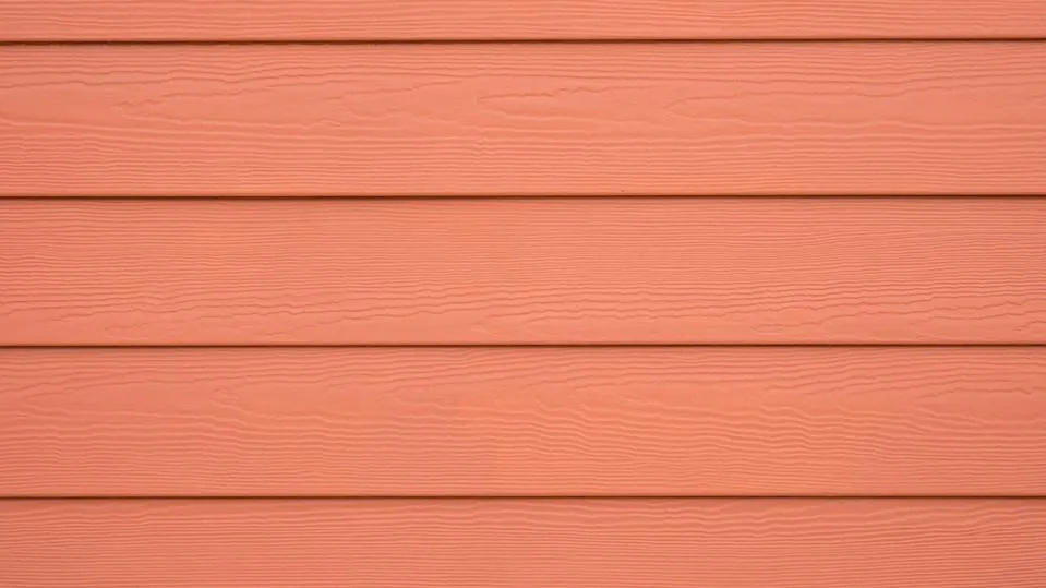 Coral fiber cement lap siding with wood grain texture from Affordable Siding, Windows & Roofing