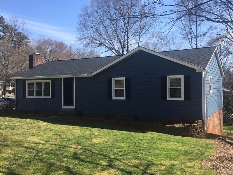 A House With Blue Siding | Siding and Windows