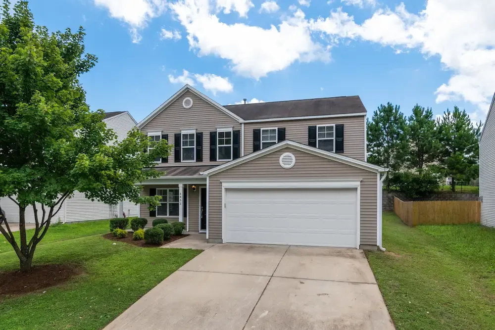 Tan James Hardie fiber cement siding home installed by Affordable Siding, Windows & Roofing