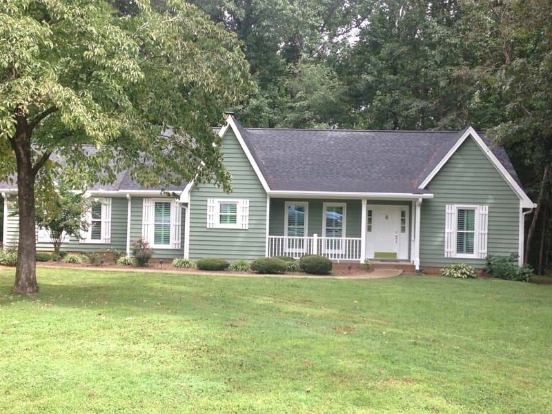 A House With Light Green Siding | Siding and Windows