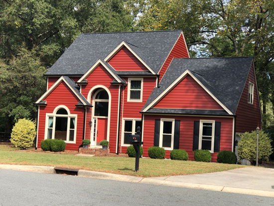 A House With Red Siding - Front View | Siding and Windows